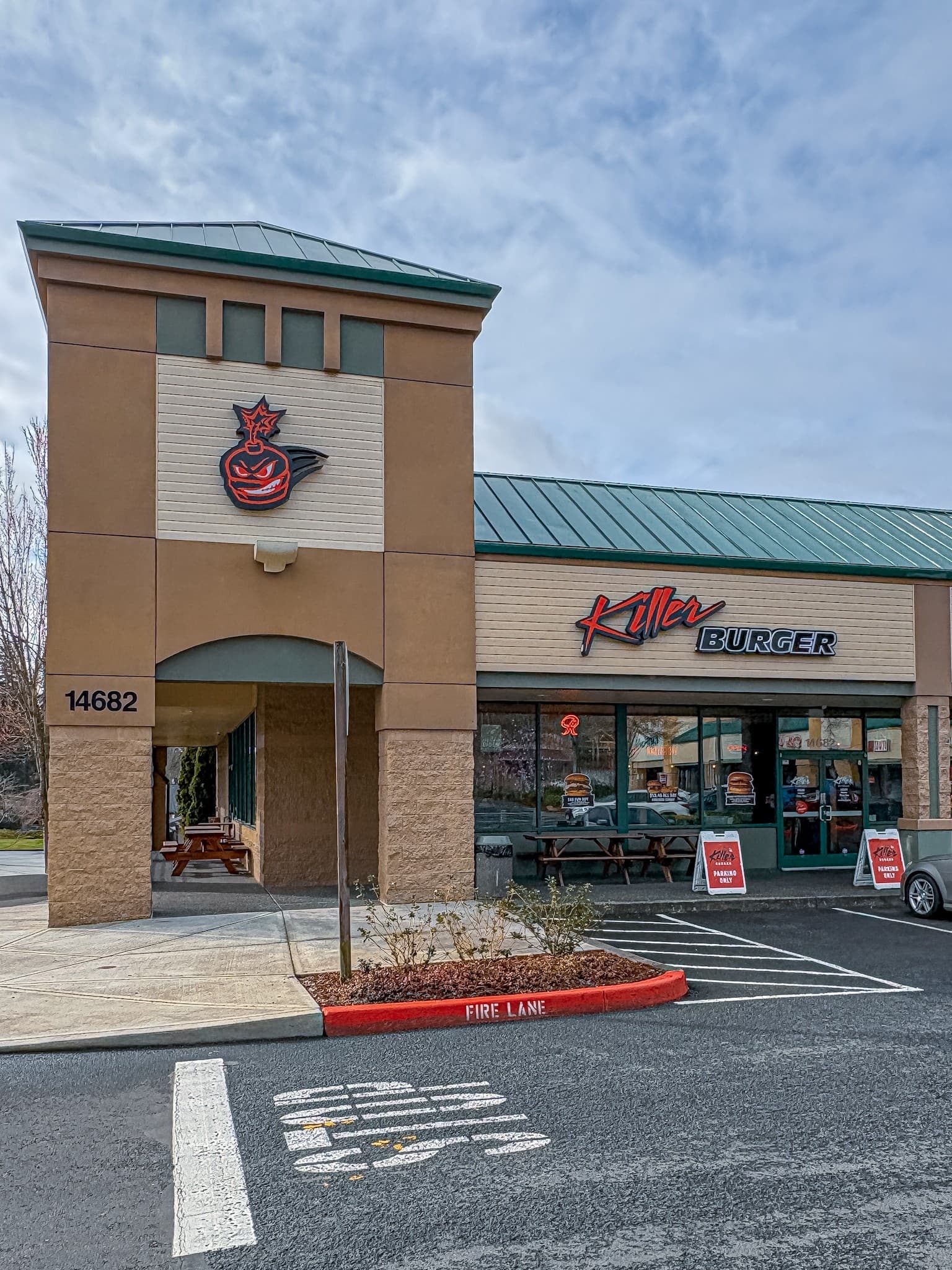 Killer Burger Happy Valley — exterior storefront with tower signage and patio seating